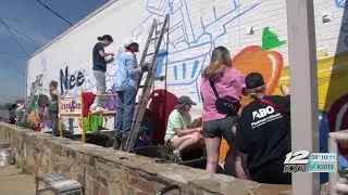 Austin College helping paint mural for Sherman's Grand Central Station
