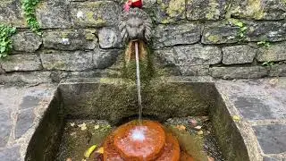 Red Iron-Rich Water at The Lions Head Spring, The Chalice Well, Glastonbury, UK