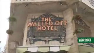 Street artist Banksy opens Walled Off Hotel in Bethlehem