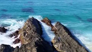 Surfing at Bennetts Head, One Mile Beach