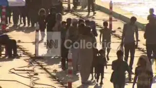 IRAQ: YAZIDI REFUGEES CROSS RIVER INTO SYRIA