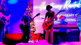 Scarlett and her band playing 
