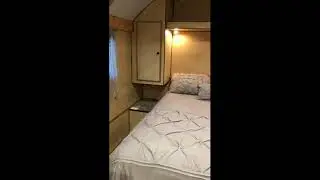 A walkthrough of a custom 20' living space wide range camp with the side entry door.