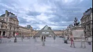 Tourists walk near the Louvre in Paris timelapse hyperlapse