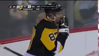 Crosby bats the puck out of mid air and into the net