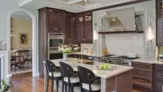 Remodeled open-plan kitchen mixes traditional and contemporary design elements