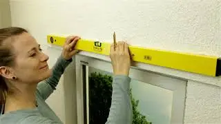 E1 Come montare una tenda a rullo S/M con supporti metallici alla parete
