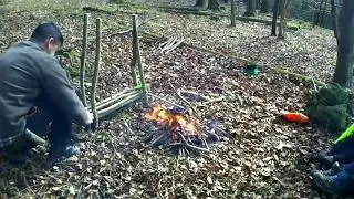 Setting up a camp in the woods and cooking lunch