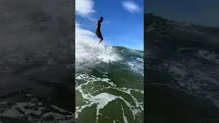 Longboard surfing in Praia da Macumba, Rio de Janeiro.