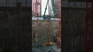 Craning two excavators out from a 100ft deep hole in downtown Vancouver!