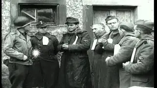 U.S. Army soldiers guard German SS-Totenkopfverbände (SS-TV) prisoners...HD Stock Footage