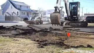 Bobcat E50 Ripping Up Asphalt Driveway