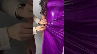 Share with a friend who would own the spotlight in this metallic purple draped gown! To order, send