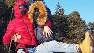 Jacket with goggles on the hood. Jacket with a fastening hood with a mask covering the face.