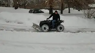 2009 Yamaha Grizzly 350 plowing snow. 54
