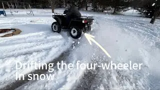 Drifting the four-wheeler in the snow(got stuck)