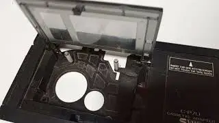 Testing a dusty JVC C-P7U vintage VHS-C to VHS adapter. Working mechanics.