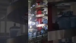 Big fresh water pots conveying by spiral conveyor system testing in customer's factory