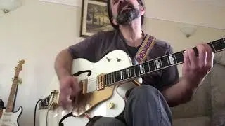 Woman on a Gretsch White Falcon ..remembering John Lennon