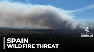 Spain wildfires burn vast land as temperatures drop but risks remain high