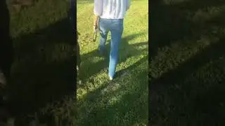 Walking with one shoe on and one shoe of, one bare foot