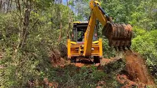 jcb 3dx super working in New road construction