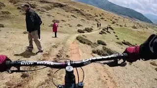 Cycling down open pasture at Gangtey Valley 22 April 23