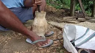 Dikka chu rongdik tarigipa(carving wooden Garo traditional wine storage 