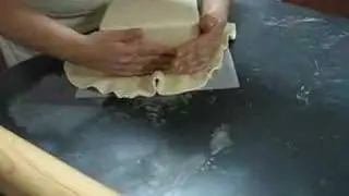 Covering a square cake  with fondant