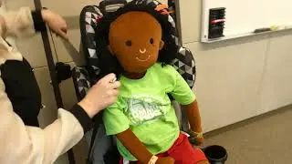 Putting child in Booster Seat, English, 2026