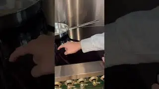 How to use the power boost feature on an induction range top