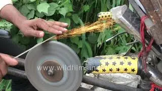 Cycle-powered knife sharpener caught in action - Sparks flying off the grindstone