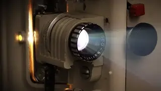 Stock footage - Old film projector running (with sound)