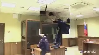 russian man  tries to escape from glass box