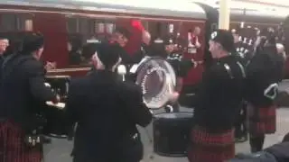 Bolton Caledonia Pipe Band playing as the Flying Scotsman departs Bury station.