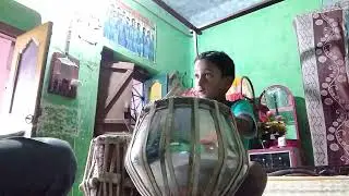 Little boy learning tabla  with positive mode.