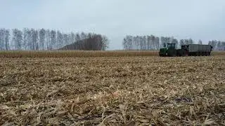 Russia farming. John Deere 9530  on the Corn Harvest