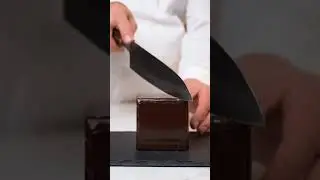 Watch the magic unfold! A simple chocolate cube hides a rainbow candy surprise inside 🌈#DessertCuts