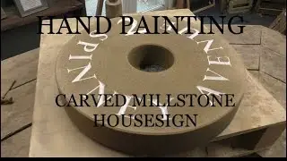 Painting a hand carved stone house sign