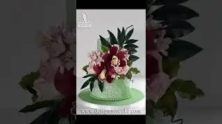 Super adorable cake with gumpaste flowers. Love the gumpaste orchid! #amazingcakes #sweetcake