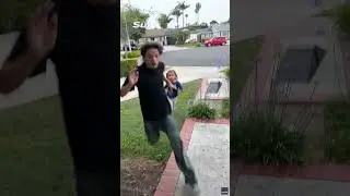 Lightning strikes tree behind young child during SoCal thunderstorms