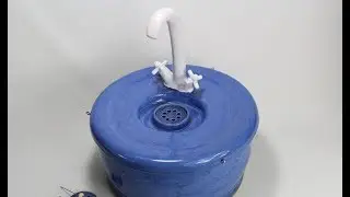 A dismantle proof XL ceramic cat drinking fountain with faucet spout