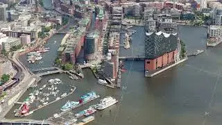 Scenic aerial view of Hamburg cityscape, featuring Elbphilharmonie concert hall and historic