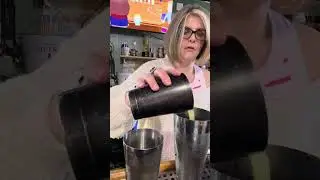 Making delicious drinks with flaming fruit garnish