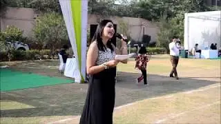 Emcee Dhaarna hosting a corporate sports event.