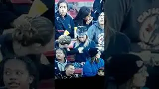 Lesbian love caught on camera in sports crowd.