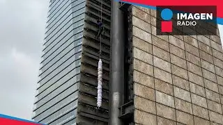 Luego de 6 horas, activistas llegan a lo m&aacute;s alto de la Estela de Luz