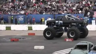 Grim Reaper monster truck jumps cars