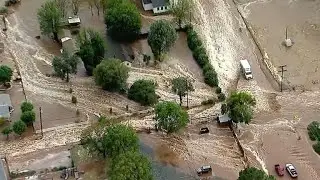 Trapped driver rescued as flash flooding hits California