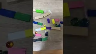 Marble chain reaction on a table  #marblerun #rubegoldberg #rubegoldbergmachine #dominos